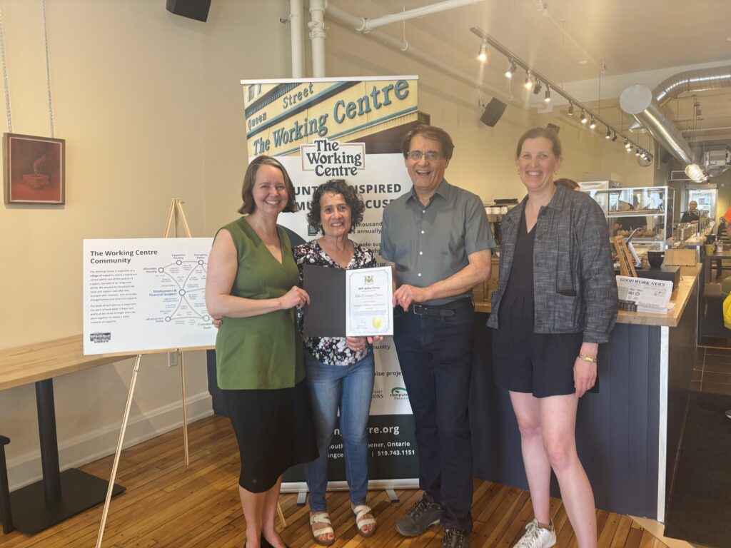 Aislinn Clancy, Joe Mancini, a Board Member and a Working Centre staff